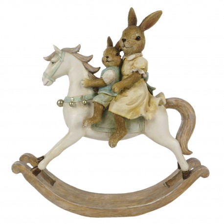 Velikonoční dekorace králíčků na houpacím koníkovi